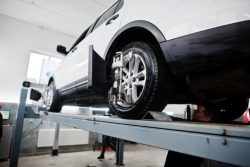 American,Suv,Car,On,Stand,For,Wheels,Alignment,Camber,Check