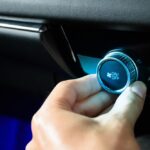 Hand,Turning,The,Button,Car,Air,Conditioning,Fan,To,Air