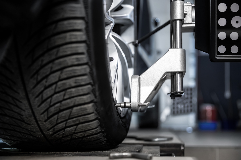Close-up,Car,Wheel,Indoors,Service,Maintenance,Repair,Center,Against,Laser