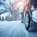 Car,Tires,On,Winter,Road,Covered,With,Snow