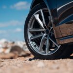 Close-up,View,Of,Wheel,Of,Sports,Car,At,The,Gravel